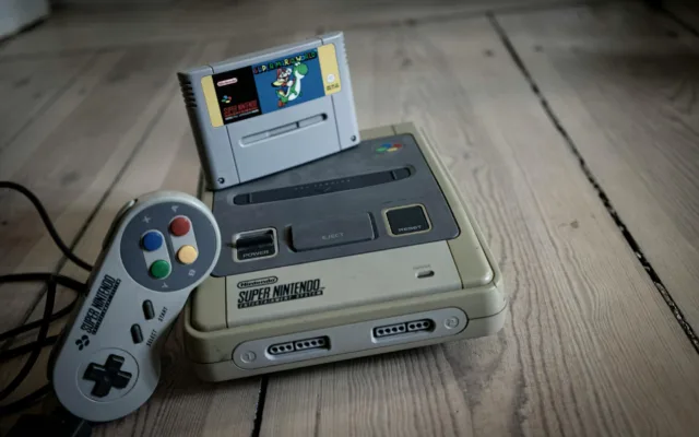 old video game pad with controller and cassette